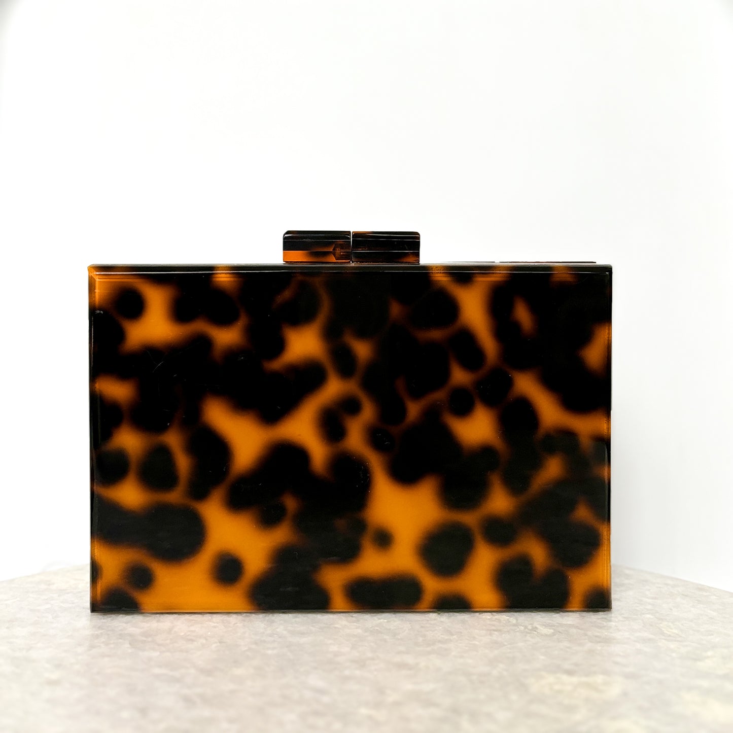 the𝗡𝗗𝗟𝗣𝗧bag™ acrylic clutch bag with painted monogram