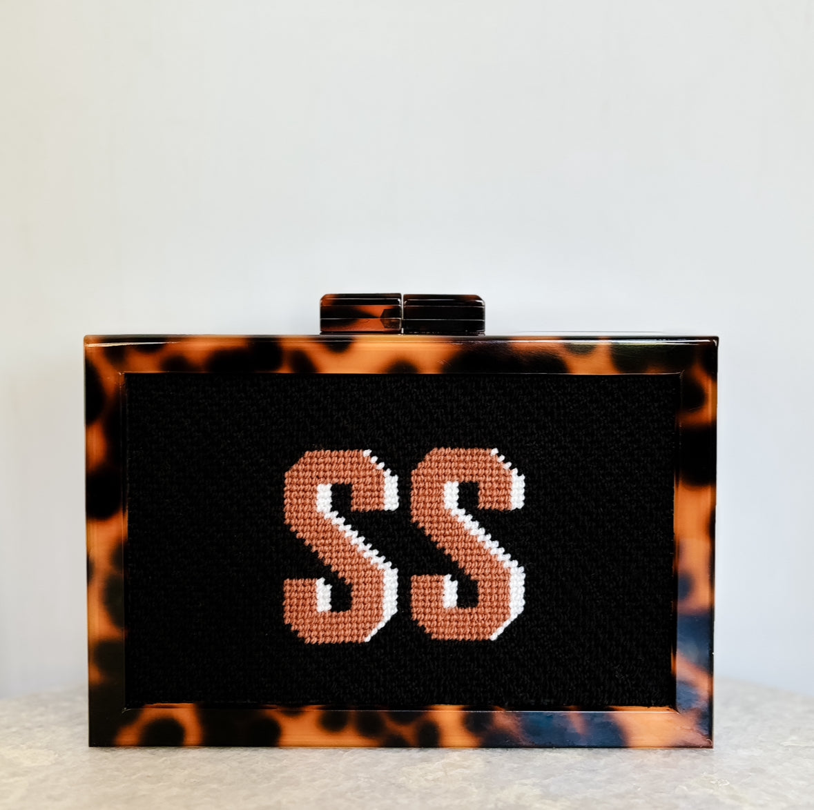 the𝗡𝗗𝗟𝗣𝗧bag™ acrylic clutch bag with painted monogram