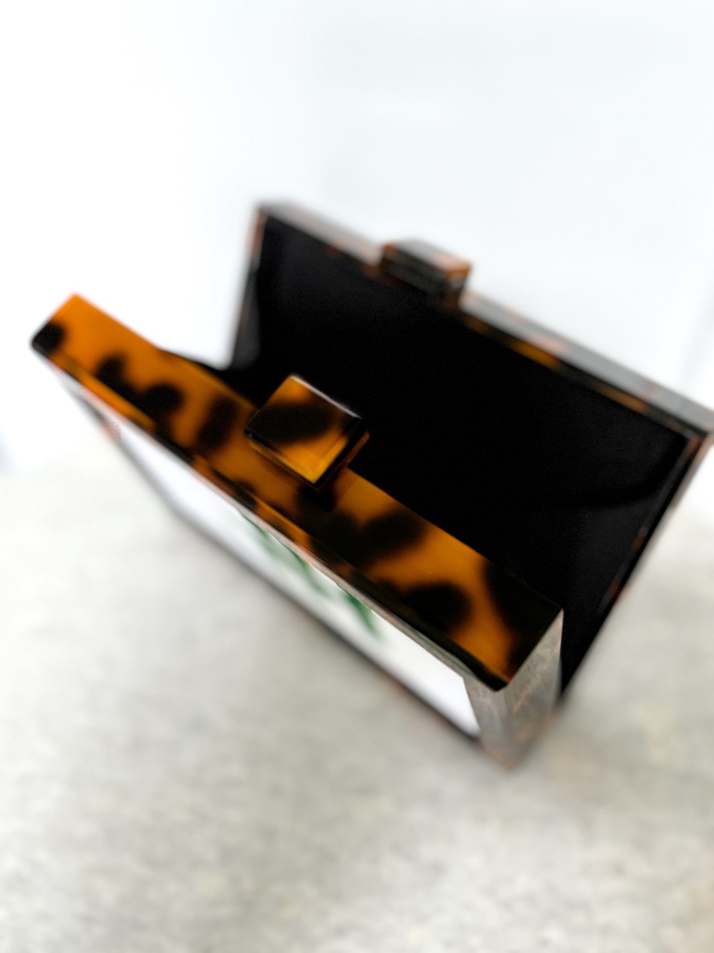 the𝗡𝗗𝗟𝗣𝗧bag™ acrylic clutch bag with painted monogram