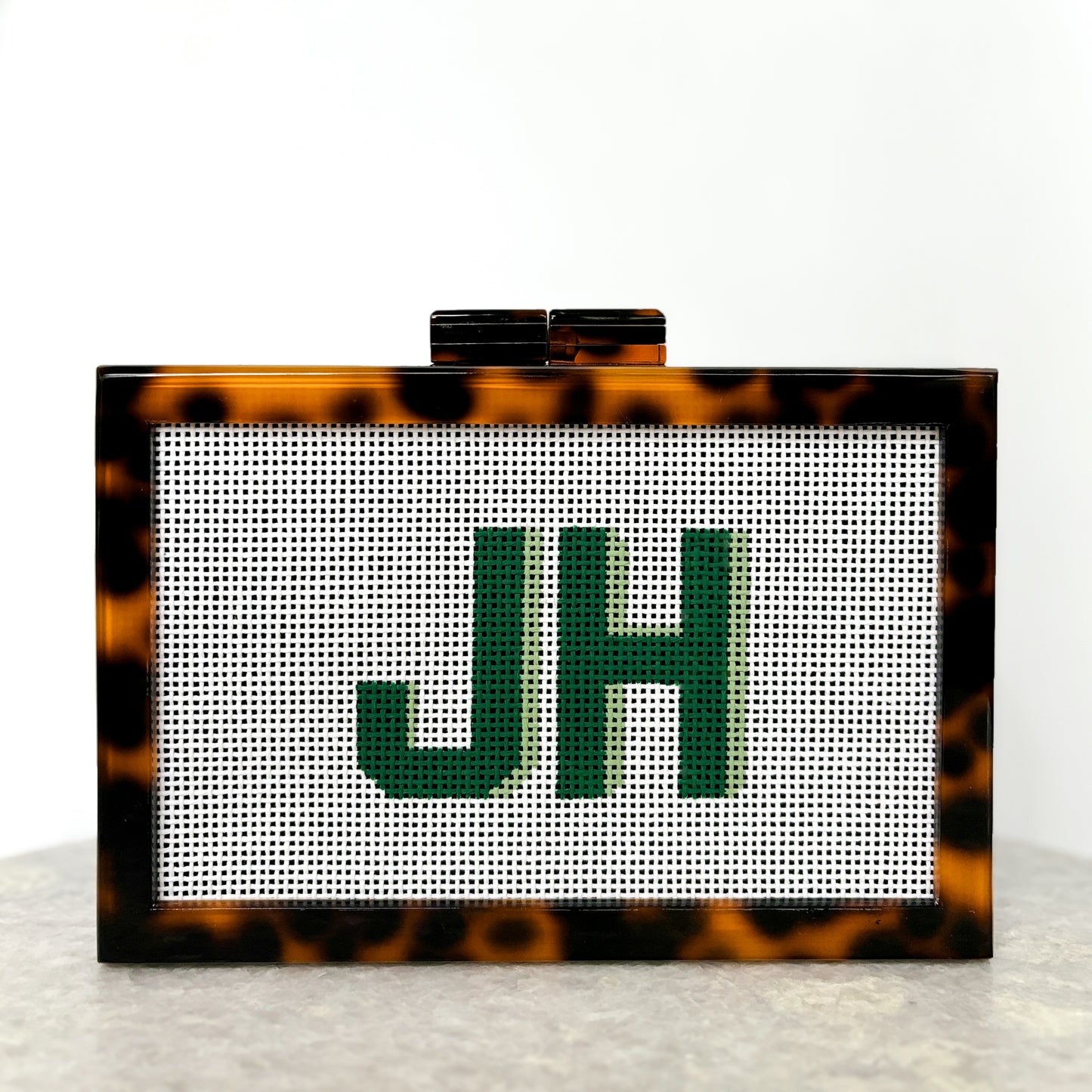 the𝗡𝗗𝗟𝗣𝗧bag™ acrylic clutch bag with painted monogram