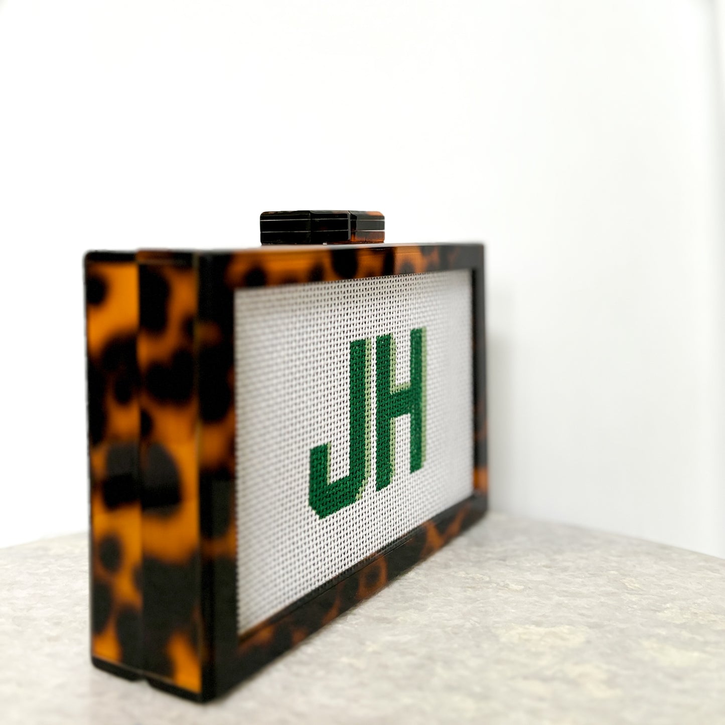 the𝗡𝗗𝗟𝗣𝗧bag™ acrylic clutch bag with painted monogram